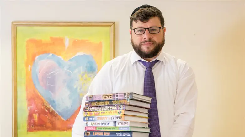 Chaim Walder with some of his books