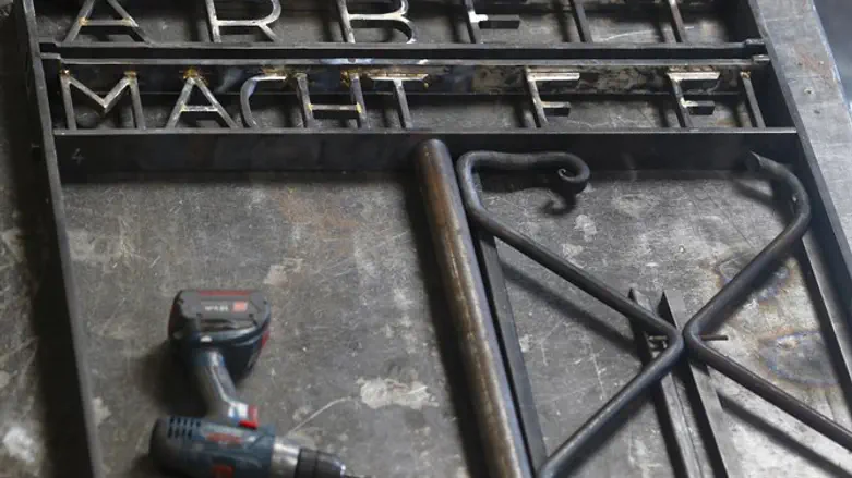 Replica of Dachau's "Arbeit macht frei" sign