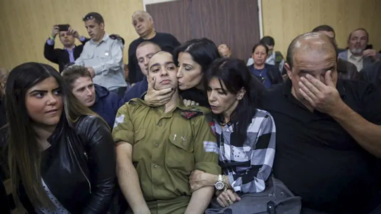Elor Azariya sits with his family as verdict handed down