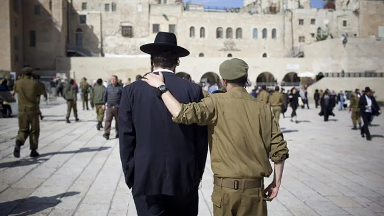 Haredi man and soldier at the Kotel