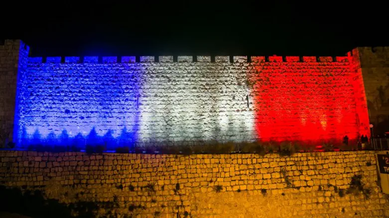 Jerusalem's city walls illuminated with colors of French flag