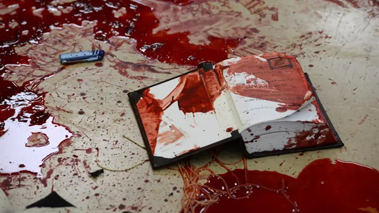 Bloodied prayer book in Har Nof attack