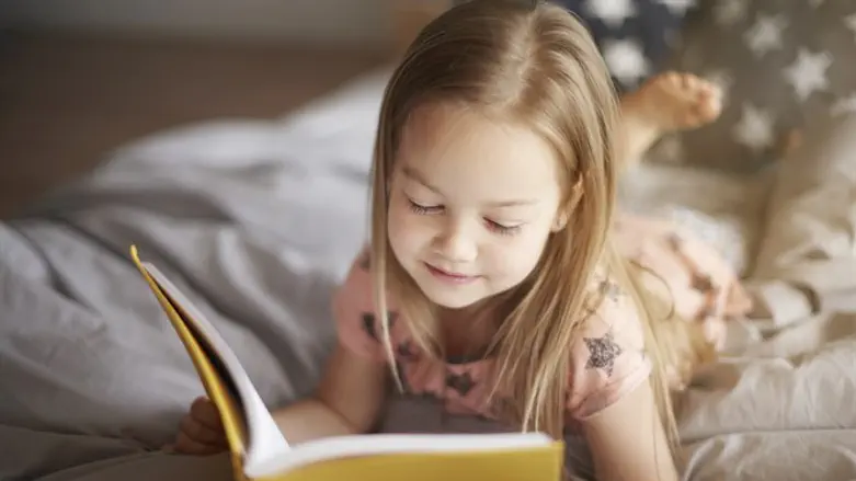 A girl reads a book