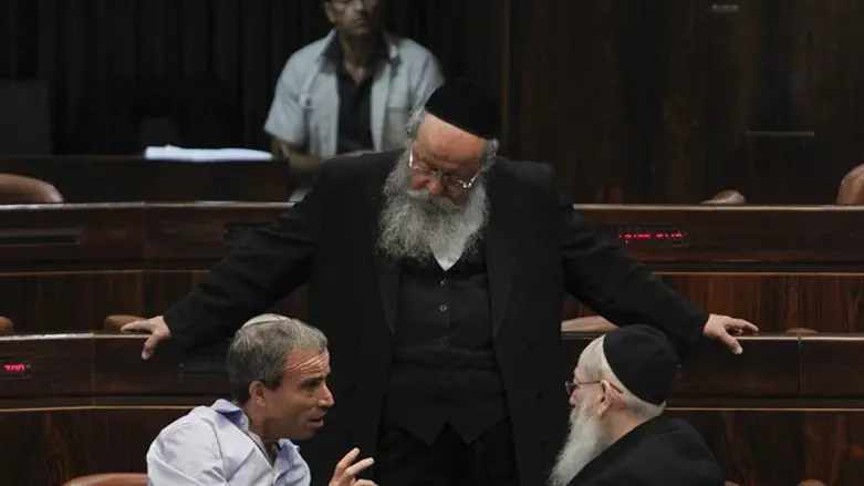 MK Menachem Eliezer Mozes listens to MK Elazar Stern