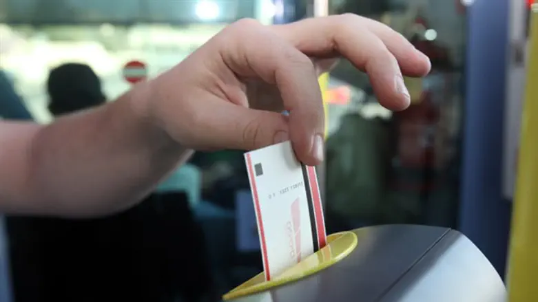 Light rail train passenger pays with single-use paper ticket