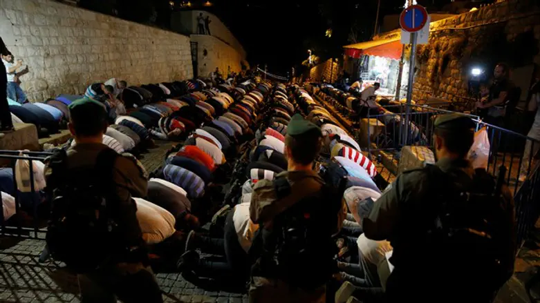 Arabs praying outside Temple Mount