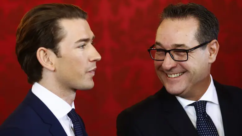 Austrian Vice Chancellor Strache of the FPOe smiles next to Chancellor Kurz
