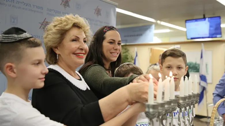 New immigrants from Ukraine celebrate Hanukkah at Ben Gurion Airport
