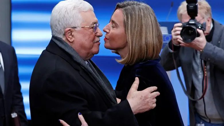 Mahmoud Abbas is greeted by EU foreign affairs chief Federica Mogherini
