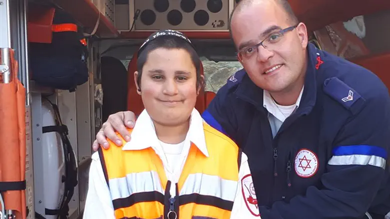 Shalom Dovber Yonah with MDA paramedic Yisrael Katz