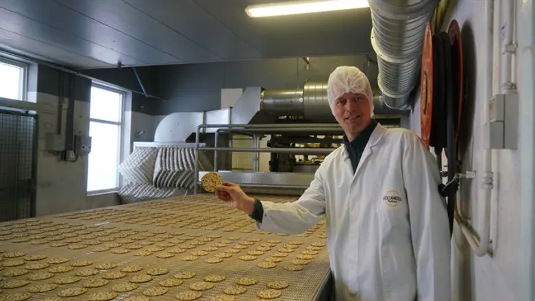 Pieter Heijs showing one of the products of his Hollandia Matzes factory in Enschede.