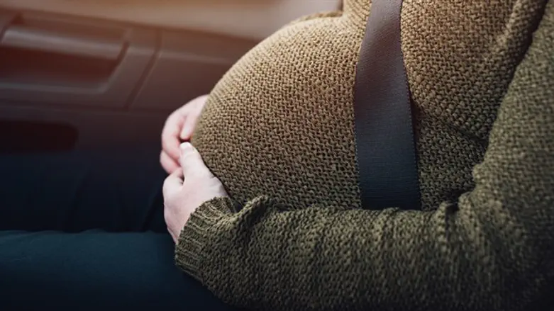 Pregnant woman in car