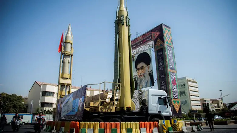 Display featuring missiles and portrait of Iran's Supreme Leader Khameni