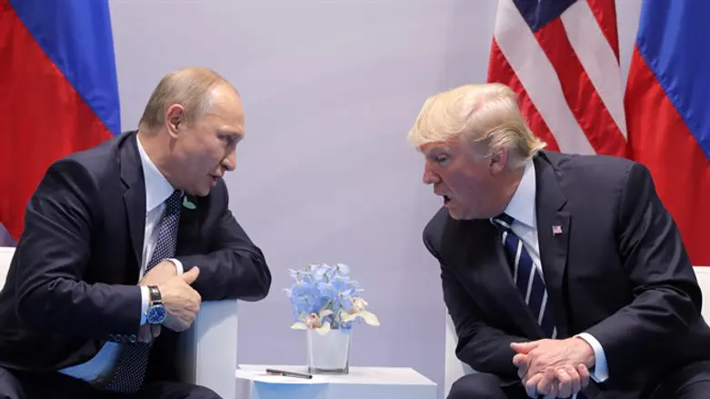 U.S. President Donald Trump speaks with Russian President Vladimir Putin