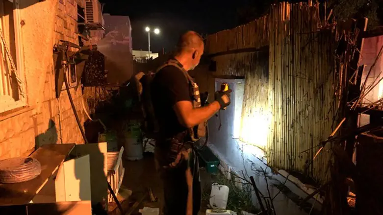 police inspect site where rocket struck in Sderot