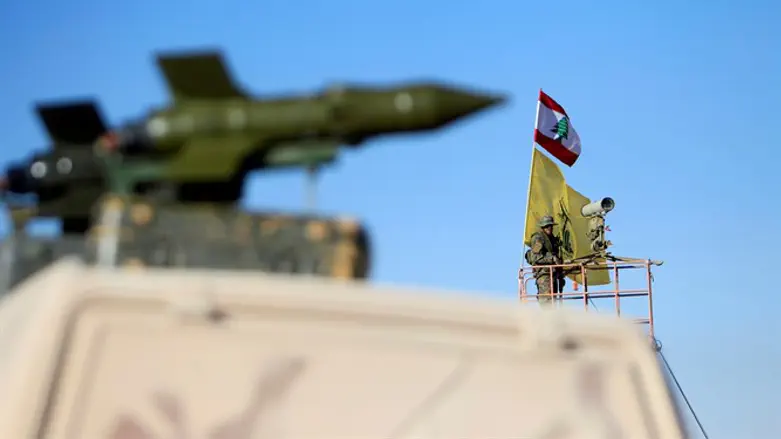 Hezbollah terrorist stands at watch tower at Juroud Arsal, Syria-Lebanon border
