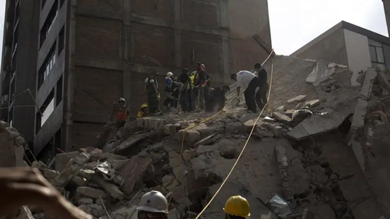 Rescuers work in the rubble after a magnitude 7.1 earthquake struck Mexico City.