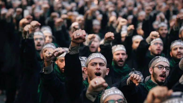 Lebanon's Hezbollah supporters chant slogans during last day of Ashura in Beirut