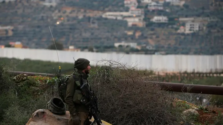 Israeli soldier guards near border with Lebanon
