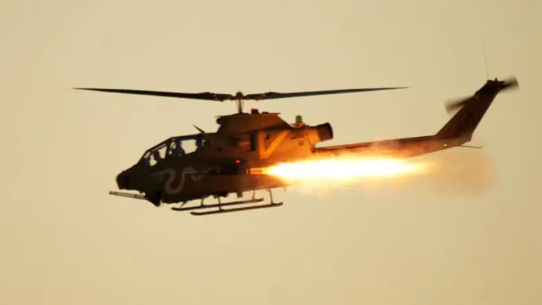 IDF Cobra helicopter firing missile