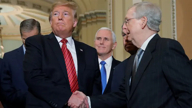 Trump shakes hands with Mitch McConnell