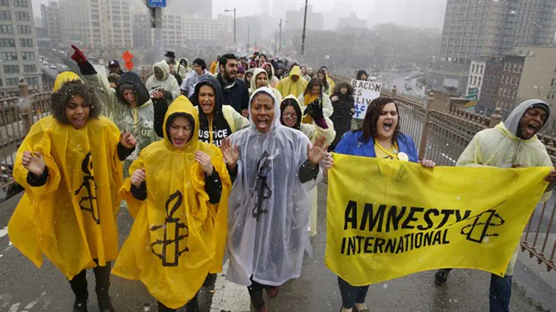 Amnesty International activists demonstrate in NY