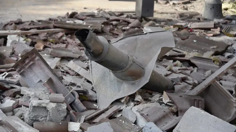 Remains of rocket in rubble of destroyed home