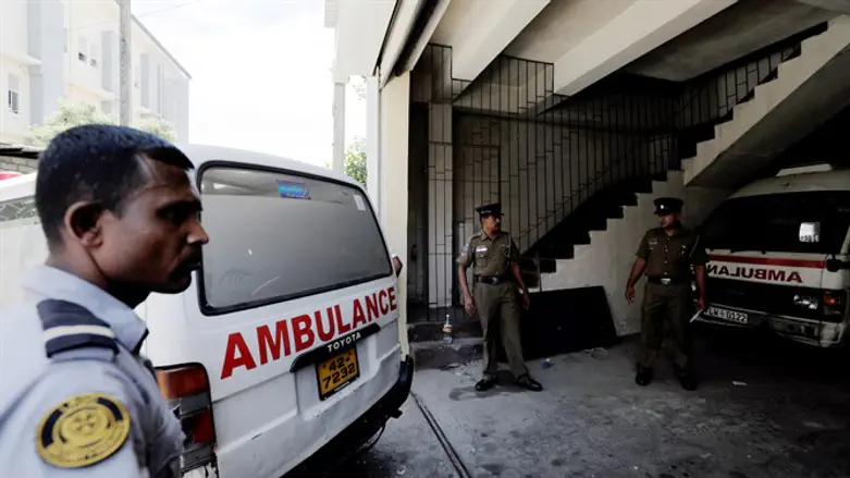 Ambulance carrying victims of Sri Lanka bombings backs into police morgue