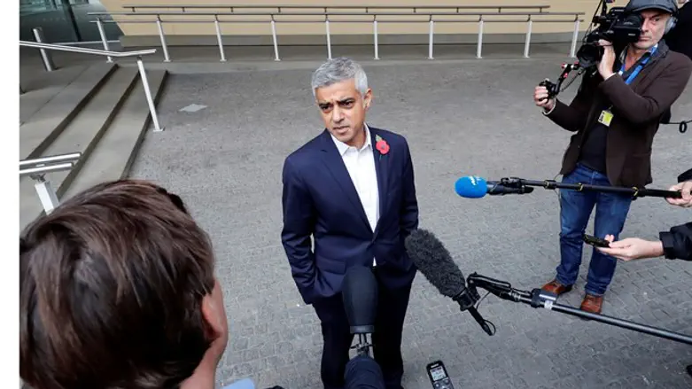 London Mayor Sadiq Khan talks to reporters