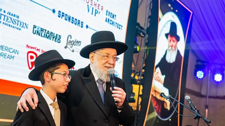 Moshe Holtzberg with former Chief Rabbi Yisrael Meir Lau
