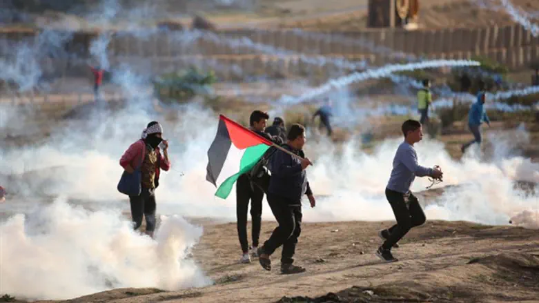 Protesters clash with Israeli soldiers during demonstration along Gaza border