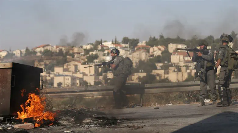 Israeli troops respond to firebombing