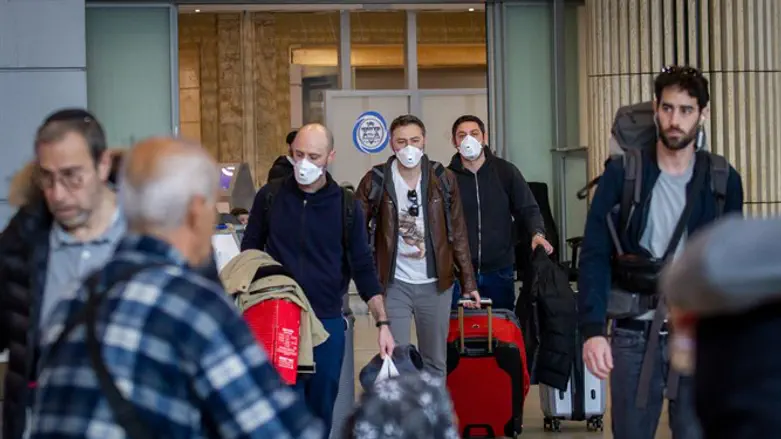Citizens at Ben Gurion Airport with anti-Coronavirus masks
