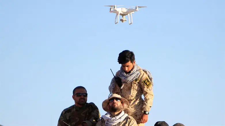 Drone hovers over Hezbollah fighters