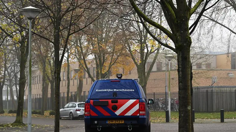 A car belonging to the Dutch security forces guards Maimonides & Rosj Pina