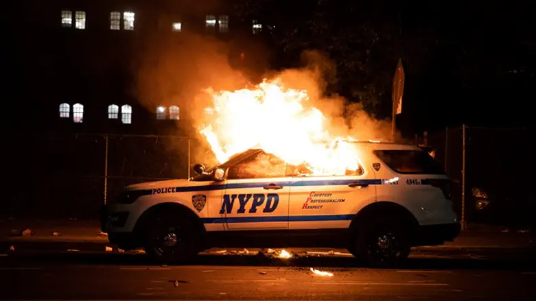 NYPD vehicle torched during riots in New York