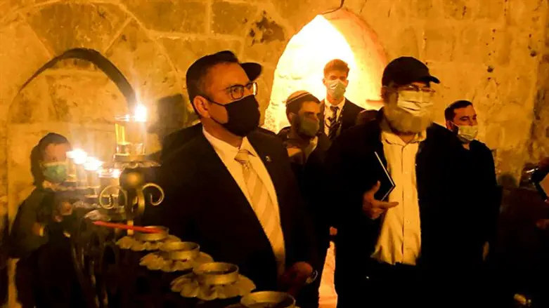 Moshe Lion lights candles at the Little Western Wall