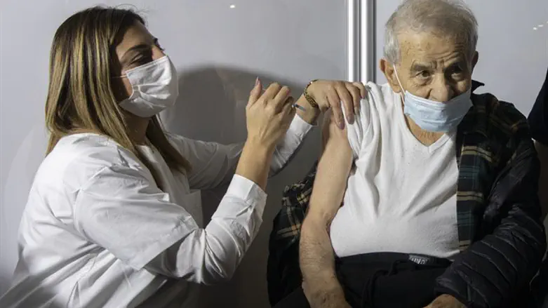 Benjamin Golan a 96 old year Israely elderly man receives a Covid-19 vaccine