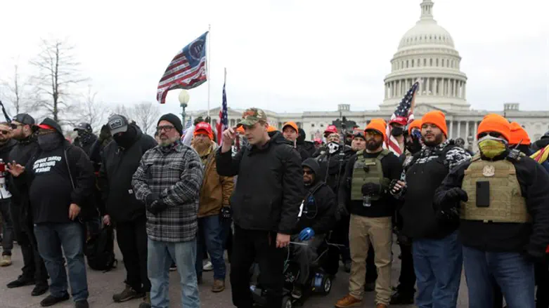 Proud Boys members pose in front of US Capitol
